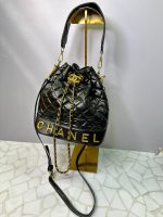 کیف دستی و دوشی زنانه مشکی مدل بوقچه‌ای با یراق طلایی