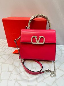 کیف دستی مجلسی ولنتینو مدل لوکس با دسته نگین‌دار و بند زنجیری