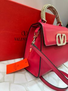 کیف دستی مجلسی ولنتینو مدل لوکس با دسته نگین‌دار و بند زنجیری